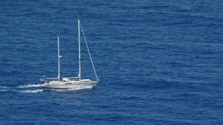 AX102_105E - 4.8K aerial stock footage sail boat in sapphire blue waters, Culebra, Puerto Rico