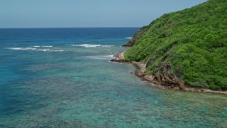 AX102_114 - 4.8K aerial stock footage of Sapphire blue waters along a rugged coastline, Culebra, Puerto Rico 