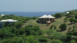 AX102_154 - 4.8K aerial stock footage of a Hilltop home with ocean views, Culebra, Puerto Rico
