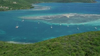 AX102_159 - 4.8K aerial stock footage of Sailboats near a reef in sapphire blue waters, Culebra, Puerto Rico 