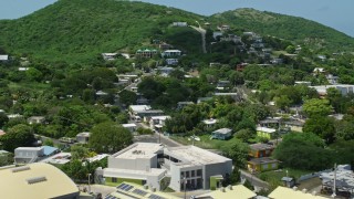AX102_163E - 4.8K aerial stock footage of a factory and homes along the coast, Culebra, Puerto Rico