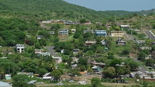 AX102_165 - 4.8K aerial stock footage of Residential neighborhoods on a hillside, Culebra, Puerto Rico 