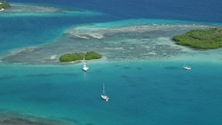 AX102_172 - 4.8K aerial stock footage of a Fishing boat near a reef in turquoise waters, Culebra, Puerto Rico