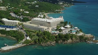 AX102_231E - 4.8K aerial stock footage of Marriott's Frenchman's Cove on sapphire blue waters,  St Thomas