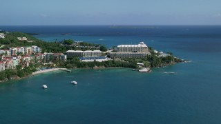 AX102_232 - 4.8K stock footage aerial video of Marriott's Frenchman's Cove on sapphire blue waters, St Thomas 