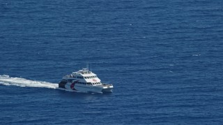 AX102_237 - 4.8K aerial stock footage of a Catamaran in blue ocean waters, Southside, St Thomas 