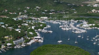 AX102_239 - 4.8K aerial stock footage of Boats in a marina, Benner Bay, St Thomas