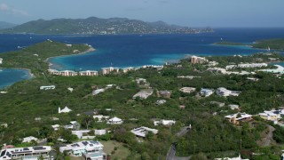 AX102_242 - 4.8K aerial stock footage of The Ritz-Carlton resort along turquoise waters, St Thomas