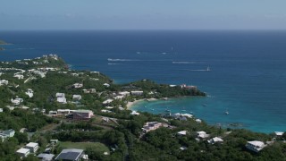 AX102_245 - 4.8K aerial stock footage of Secret Harbor Beach Resort resting along turquoise Caribbean waters, St Thomas, US Virgin Islands