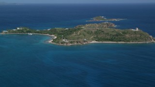 AX102_249 - 4.8K aerial stock footage of Little St James Island in sapphire blue waters, St Thomas, Virgin Islands