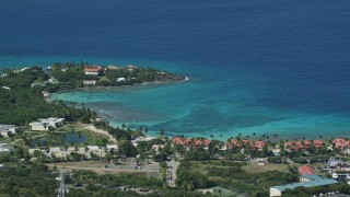 AX102_257 - 4.8K stock footage aerial video of Condominiums along sapphire blue Caribbean waters, East End, St Thomas