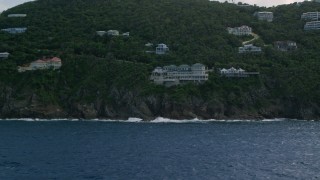 AX102_263 - 4.8K aerial stock footage a Hillside mansion looking out at sapphire blue waters, Northside, St Thomas 
