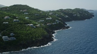 AX102_267 - 4.8K stock footage aerial video of an Oceanfront hillside mansions, Northside, St Thomas 