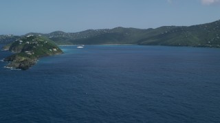 AX102_279 - 4.8K aerial stock footage Approaching Picara Point, leading to crystal blue water in Magens Bay, St Thomas, USVI