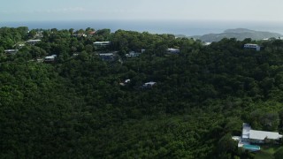 AX102_291 - 4.8K aerial stock footage of Hilltop oceanfront homes reveal Caribbean blue waters, Northside, Charlotte Amalie