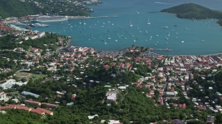 AX102_293 - 4.8K aerial stock footage of a Coastal town along turquoise blue Caribbean waters, Charlotte Amalie, St Thomas 