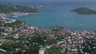 AX102_296 - 4.8K aerial stock footage of a Coastal town along turquoise Caribbean waters, Charlotte Amalie, St Thomas 