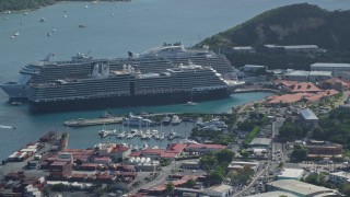 AX102_304 - 4.8K aerial stock footage of a Docked cruise ships in turquoise blue Caribbean waters, Charlotte Amalie, St Thomas 