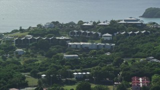 AX102_305 - 4.8K aerial stock footage of University of the Virgin Islands with a view of Caribbean waters, St Thomas