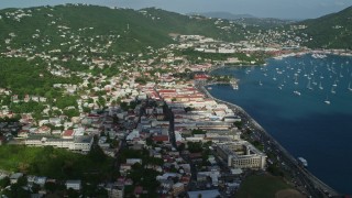AX103_004 - 4.8K aerial stock footage of a Coastal town along Caribbean blue waters, Charlotte Amalie, St Thomas