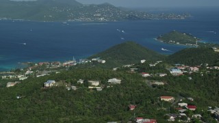 AX103_013 - 4.8K aerial stock footage Caribbean resorts along sapphire blue waters, East End, St Thomas