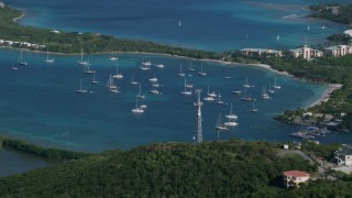 AX103_014 - 4.8K aerial stock footage of Sailboats in Caribbean blue waters, Muller Bay, St Thomas