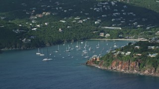 AX103_062 - 4.8K aerial stock footage of Hillside Caribbean mansions with harbor and ocean views, Cruz Bay, St John