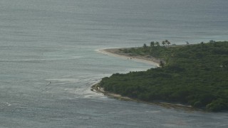AX103_115 - 4.8K aerial stock footage of Caribbean beach along turquoise blue waters, Rada Fajardo, Puerto Rico
