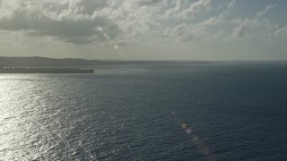 AX103_120 - 4.8K aerial stock footage of Caribbean island coast and blue waters, Luquillo, Puerto Rico