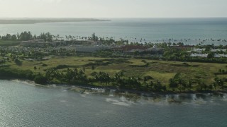 AX103_128E - 4.8K aerial stock footage of Gran Melia Golf Resort with views of Caribbean blue waters, Puerto Rico
