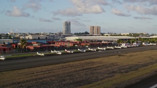 AX104_001 - 4.8K aerial stock footage of Isla Grande Airport, Puerto Rico, sunset