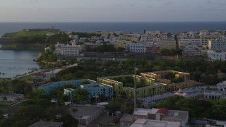 AX104_035 - 4.8K aerial stock footage of La Fortaleza and Caribbean buildings, Old San Juan sunset