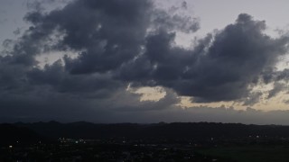 AX104_139 - 4.8K aerial stock footage of clouds at twilight over Dorado, Puerto Rico