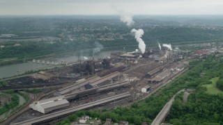 AX105_009 - 4.8K aerial stock footage approaching U.S. Steel Mon Valley Works Factory, Braddock, Pennsylvania
