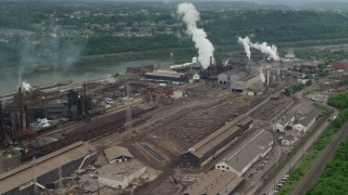 AX105_011 - 4.8K aerial stock footage of U.S. Steel Mon Valley Works Factory, Braddock, Pennsylvania