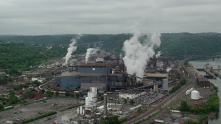 AX105_014 - 4.8K aerial stock footage orbiting U.S. Steel Mon Valley Works Factory, Braddock, Pennsylvania