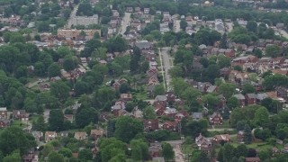 AX105_023E - 4.8K aerial stock footage of a suburban neighborhood, Munhall, Pennsylvania
