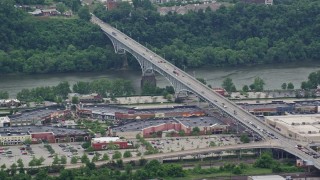 AX105_026E - 4.8K aerial stock footage of Homestead Grays Bridge and a Shopping Mall, Pittsburgh, Pennsylvania