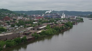AX105_048E - 4.8K aerial stock footage of U.S. Steel Mon Valley Works, Braddock, Pennsylvania
