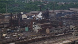 AX105_055E - 4.8K aerial stock footage of U.S. Steel Mon Valley Works Factory, Braddock, Pennsylvania