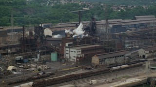 AX105_056 - 4.8K aerial stock footage of U.S. Steel Mon Valley Works Factory, Braddock, Pennsylvania