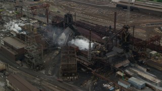AX105_059 - 4.8K aerial stock footage orbiting U.S. Steel Mon Valley Works Factory, Braddock, Pennsylvania