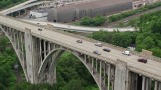 AX105_060E - 4.8K aerial stock footage approach George Westinghouse Bridge and track traffic crossing it, East East Pittsburgh, Pennsylvania