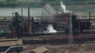 AX105_068 - 4.8K aerial stock footage of U.S. Steel Mon Valley Works Factory, Braddock, Pennsylvania