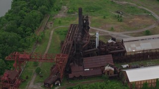AX105_071E - 4.8K aerial stock footage approaching Carrie Furnace Steel Factory, Pittsburgh, Pennsylvania