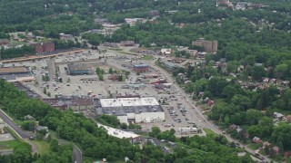 AX105_091 - 4.8K aerial stock footage orbiting a strip mall and Parking Lot, Penn Hills, Pennsylvania