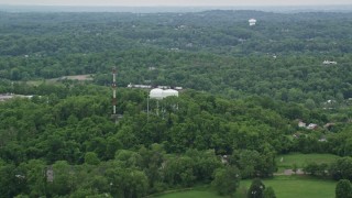 AX105_096 - 4.8K aerial stock footage of radio and water towers, Penn Hills, Pennsylvania
