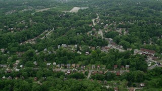 AX105_098 - 4.8K aerial stock footage flying over suburban neighborhoods, Penn Hills, Pennsylvania