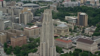 AX105_106 - 4.8K aerial stock footage orbiting the Cathedral of Learning, University of Pittsburgh, Pennsylvania