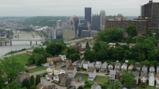 AX105_121 - 4.8K aerial stock footage approaching skyscrapers and park fountain, Downtown Pittsburgh, Pennsylvania
